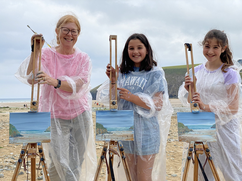 Granny and two grandaughters doing an art class with jeanni on the beach, acrylic on canvas