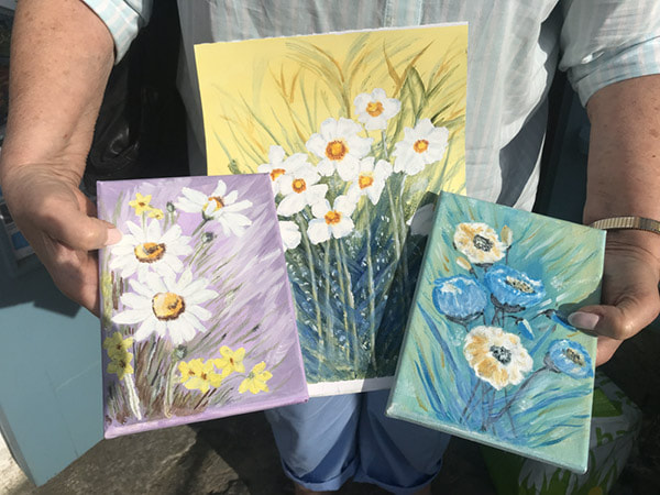 a set of floral paitings by a student. 