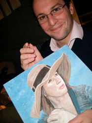 Picture of Michael with his painting of his wife after art lessons with jeanni