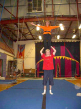 Picture of Jeanni on top of the world or at least on top of her son the juggler James - Bustar Blaxall