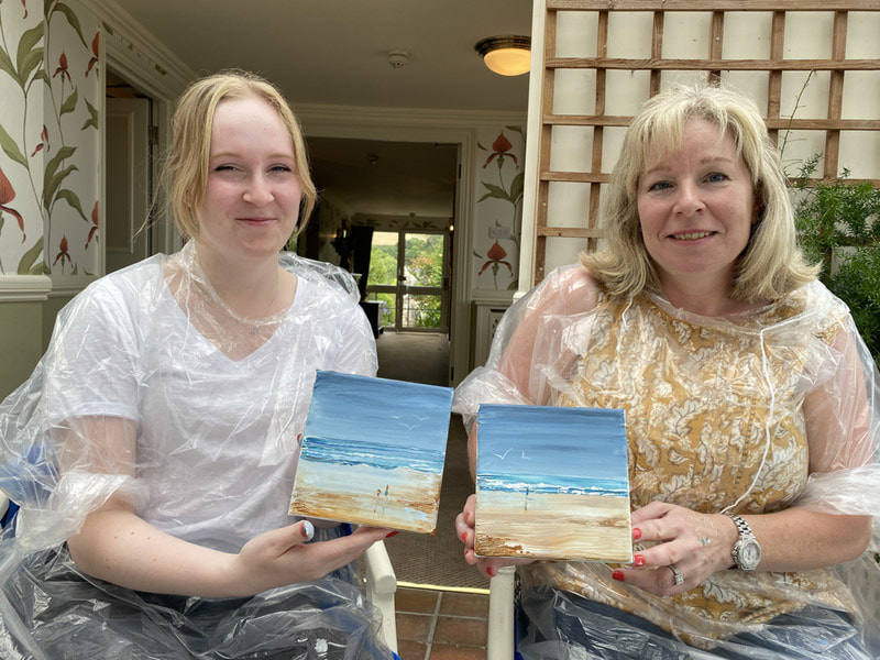 mum and daughter painting lesson.