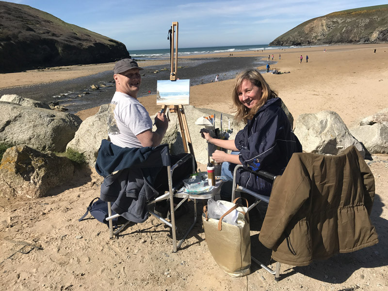 painting on mawgan porth beach in the sun